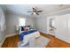 Cozy bedroom with hardwood floors, neutral paint, and a ceiling fan at 2 Collier Nw Rd # 5, Atlanta, GA 30309