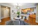 Dining area featuring modern lighting, a breakfast bar pass-through to kitchen, and hardwood floors at 2 Collier Nw Rd # 5, Atlanta, GA 30309