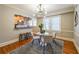 Dining area featuring modern lighting, a breakfast bar pass-through to kitchen, and hardwood floors at 2 Collier Nw Rd # 5, Atlanta, GA 30309