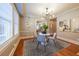 Elegant dining area featuring modern chandelier, wood floors, and stylish decor at 2 Collier Nw Rd # 5, Atlanta, GA 30309