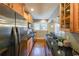 Bright kitchen featuring wood cabinets, stainless steel appliances, and a breakfast bar at 2 Collier Nw Rd # 5, Atlanta, GA 30309