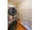 Laundry room with modern washer, dryer, and wire rack shelving at 2 Collier Nw Rd # 5, Atlanta, GA 30309