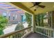 Exterior porch area with a view of the city and lush trees at 2 Collier Nw Rd # 5, Atlanta, GA 30309