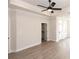 Bright room boasts a trey ceiling with a fan, recessed lighting, light wood-style flooring, and access to a private balcony at 540 Fisher Dr # 46, Alpharetta, GA 30009