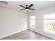 Bright bedroom with wood floors, neutral walls, a ceiling fan and multiple windows, creating a serene retreat at 540 Fisher Dr # 46, Alpharetta, GA 30009