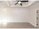 Bright room featuring a tray ceiling with a fan, recessed lighting, light wood-style flooring, and crisp white trim work at 540 Fisher Dr # 46, Alpharetta, GA 30009