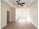 Light and airy room featuring a trey ceiling with a fan, light wood-style flooring, and stylish white trim work at 540 Fisher Dr # 46, Alpharetta, GA 30009