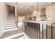 Open concept kitchen with stainless steel appliances and island, connecting to the living area at 540 Fisher Dr # 46, Alpharetta, GA 30009
