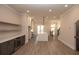 Open living space featuring a modern wine bar, floating shelves and luxury flooring at 540 Fisher Dr # 46, Alpharetta, GA 30009