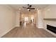 Spacious living room with light hardwood floors, fireplace, and seamless flow into the kitchen at 540 Fisher Dr # 46, Alpharetta, GA 30009