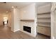 Beautiful living room featuring a fireplace, custom shelving, and large windows for natural light at 540 Fisher Dr # 46, Alpharetta, GA 30009
