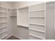 Spacious walk-in closet with white shelving and ample hanging space for clothes and accessories, perfect for organization at 540 Fisher Dr # 46, Alpharetta, GA 30009