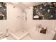 Beautiful bathroom featuring a stand-up shower and soaking tub beneath tropical wallpaper at 570 Park Se Ave, Atlanta, GA 30312