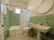 Charming bathroom featuring vintage green tile, classic fixtures, and a clean, well-maintained appearance at 570 Park Se Ave, Atlanta, GA 30312