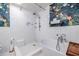 Bright, tiled bathroom featuring a modern shower, standalone tub, and tropical wallpaper at 570 Park Se Ave, Atlanta, GA 30312