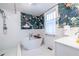 Chic bathroom with unique wallpaper, standalone tub, and white subway tile at 570 Park Se Ave, Atlanta, GA 30312