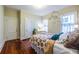 Stylish bedroom features unique wallpaper, hardwood floors, and lots of natural light at 570 Park Se Ave, Atlanta, GA 30312
