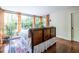 Bright bedroom with a large window showcasing the exterior landscaping and a decorative headboard at 570 Park Se Ave, Atlanta, GA 30312