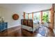 Bright bedroom with a hardwood floors, large windows and decorative headboard feature at 570 Park Se Ave, Atlanta, GA 30312