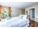 Comfortable bedroom with a large window, hardwood floors, and an ensuite bathroom at 570 Park Se Ave, Atlanta, GA 30312