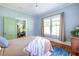 Comfortable bedroom with wood floors, view into sitting room, and bright natural light at 570 Park Se Ave, Atlanta, GA 30312