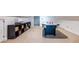 Spacious bonus room features an air hockey table and built-in shelving for storage and entertainment at 570 Park Se Ave, Atlanta, GA 30312