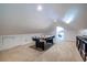 Finished bonus room with an air hockey table offers additional living space at 570 Park Se Ave, Atlanta, GA 30312