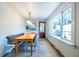 Bright dining area features a built-in banquette, hardwood floors, and lots of natural light at 570 Park Se Ave, Atlanta, GA 30312