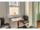 Cozy dining nook featuring built-in seating, a window view, and a breakfast table at 570 Park Se Ave, Atlanta, GA 30312