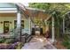 Exterior of the house showcasing a covered walkway, garden, and well-maintained landscaping at 570 Park Se Ave, Atlanta, GA 30312