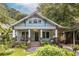 Beautiful home with a cozy front porch, mature trees, well-kept landscaping, and a private driveway at 570 Park Se Ave, Atlanta, GA 30312