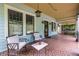 Charming front porch with outdoor seating, light blue siding, and vintage lighting at 570 Park Se Ave, Atlanta, GA 30312