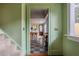 Hallway leading to kitchen, highlighting checkered flooring and a view of the interior at 570 Park Se Ave, Atlanta, GA 30312