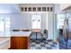 Eat-in kitchen featuring a center island, stainless appliances and breakfast nook with checkered tile floors at 570 Park Se Ave, Atlanta, GA 30312