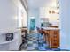 Eat-in kitchen featuring a center island, stainless appliances and breakfast nook with checkered tile floors at 570 Park Se Ave, Atlanta, GA 30312