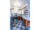 Well-lit kitchen with ample cabinetry, stainless steel appliances, checkerboard floor, and countertop workspace at 570 Park Se Ave, Atlanta, GA 30312