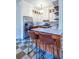 Bright modern kitchen with stainless steel appliances, marble countertops, island, and checkered tile floors at 570 Park Se Ave, Atlanta, GA 30312