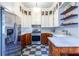 Modern kitchen with stainless appliances, center island, breakfast bar, and checkered floors at 570 Park Se Ave, Atlanta, GA 30312