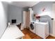 Well organized laundry room with washer, dryer, desk, and storage provides convenience and functionality at 570 Park Se Ave, Atlanta, GA 30312