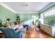 Cozy living room with green walls, hardwood floors, and stylish furnishings at 570 Park Se Ave, Atlanta, GA 30312