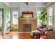 Cozy living room featuring a brick fireplace, natural light, and comfortable seating at 570 Park Se Ave, Atlanta, GA 30312