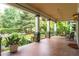 Inviting front porch with tile flooring, columns, and outdoor seating at 570 Park Se Ave, Atlanta, GA 30312