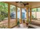 Enjoy the outdoors from this screened porch featuring ceiling fan and views of the backyard and detached garage at 570 Park Se Ave, Atlanta, GA 30312