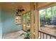 Cozy screened porch with ceiling fan and views of the backyard and lush foliage at 570 Park Se Ave, Atlanta, GA 30312