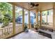 View of a cozy screened porch with wood trim and ceiling fan, offering a relaxing outdoor space at 570 Park Se Ave, Atlanta, GA 30312