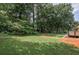The spacious backyard has mature trees and ample space for outdoor activities at 905 Hickory Ridge Sw Rd, Lilburn, GA 30047