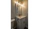 Bathroom with a new sink, vanity, modern lighting and fixtures at 905 Hickory Ridge Sw Rd, Lilburn, GA 30047