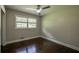 Cozy bedroom featuring hardwood floors, neutral paint and bright natural light at 905 Hickory Ridge Sw Rd, Lilburn, GA 30047