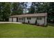 Ranch style home with a well maintained lawn and updated facade at 905 Hickory Ridge Sw Rd, Lilburn, GA 30047
