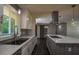 Updated kitchen showcasing stainless appliances, tile backsplash, and a central island at 905 Hickory Ridge Sw Rd, Lilburn, GA 30047